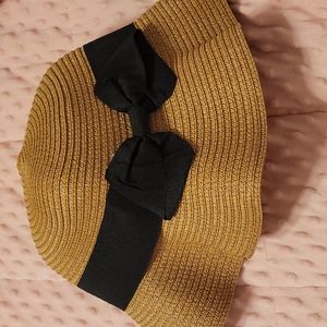 tan sunhat with black bow